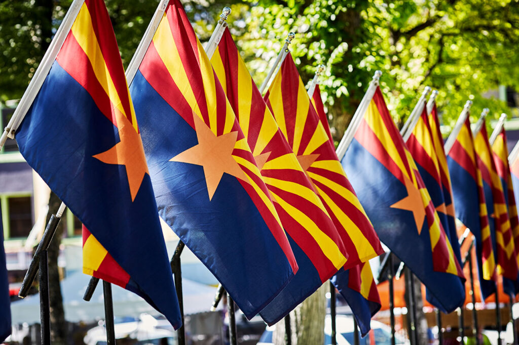 A line of Arizona state flags